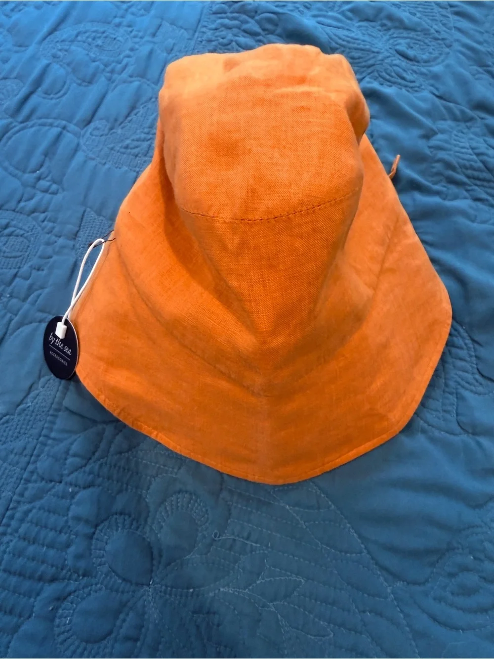 By The Sea Gold/Orange Kids Sun Bonnet/Hat with ties in back to adjust fit.